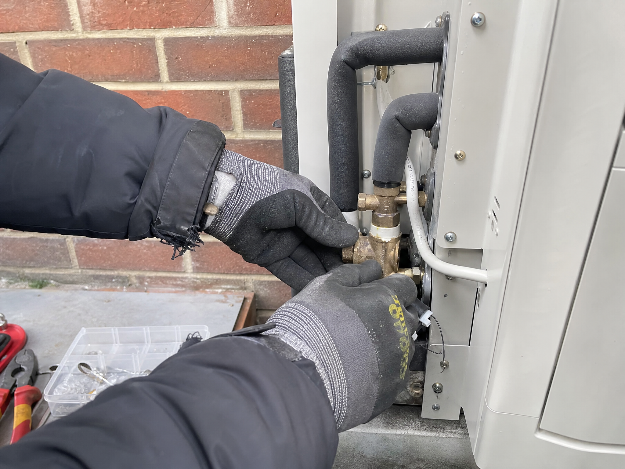 Professional installer carrying out heat pump grants through our mcs-certified partner in a UK residential property